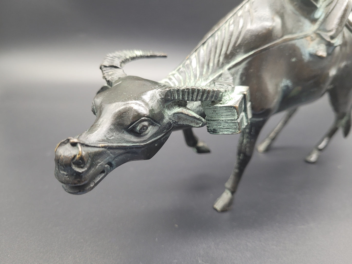 Antique Chinese Bronze of Lohan Seated On An Ox