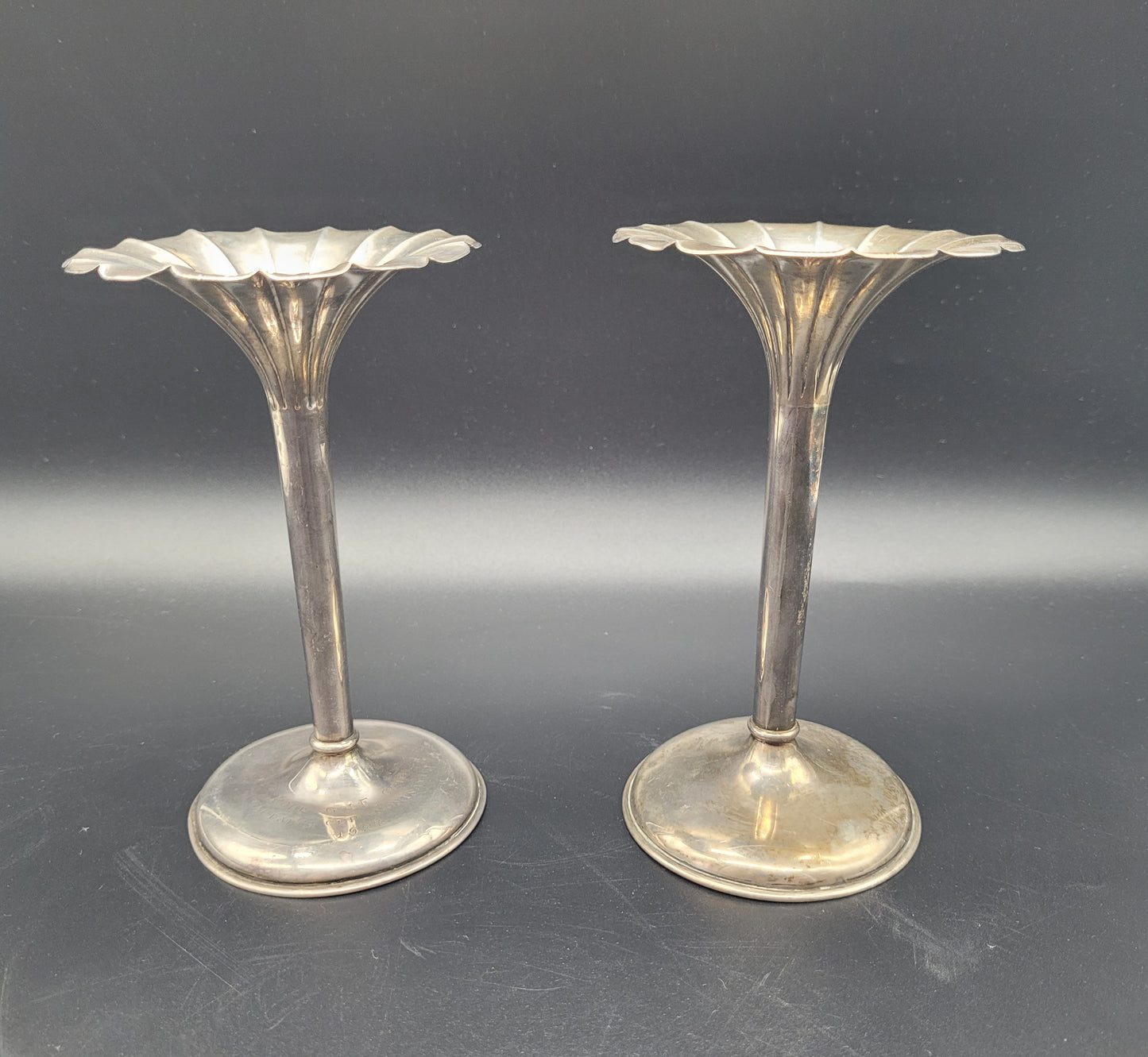 ANTIQUES & COLLECTABLES USA A very nice pair of sterling silver tulip posy vases, each set with fanned rims and graduated bases. With an inscription relating to a golfing competition.