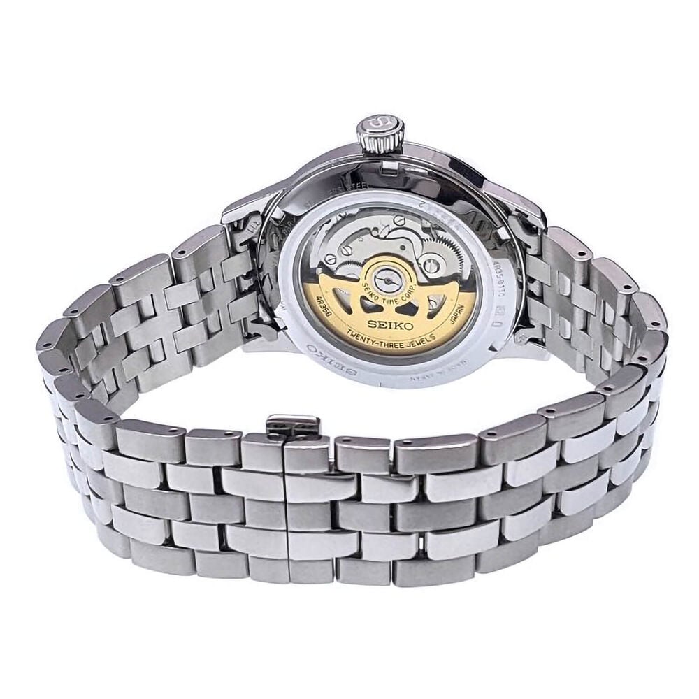 The fascinating blue sunray dial shimmers with a pattern fixed by the glossy, finishing layers - KBantiques.com