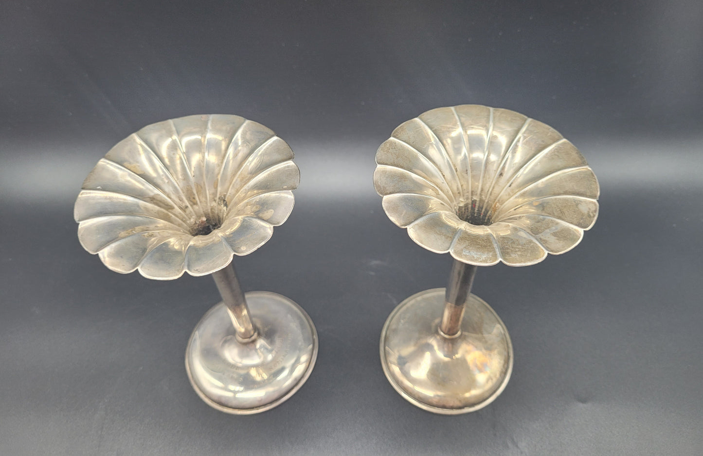 A very nice pair of sterling silver tulip posy vases, each set with fanned rims and graduated bases. With an inscription relating to a golfing competition.  KB ANTIQUES & JEWELLERY 
