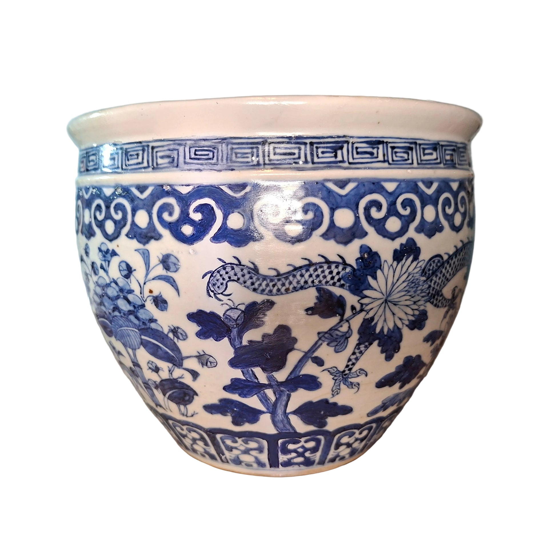 An antique blue and white fish bowl with dragon and flower decoration