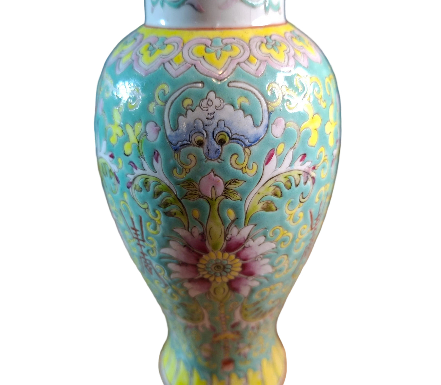 Close up view of a Chinese vase dates to the Guangxu period (1875–1908) and is beautifully crafted in the famille jaune palette, known for its warm yellow ground and vibrant enamel decoration. 