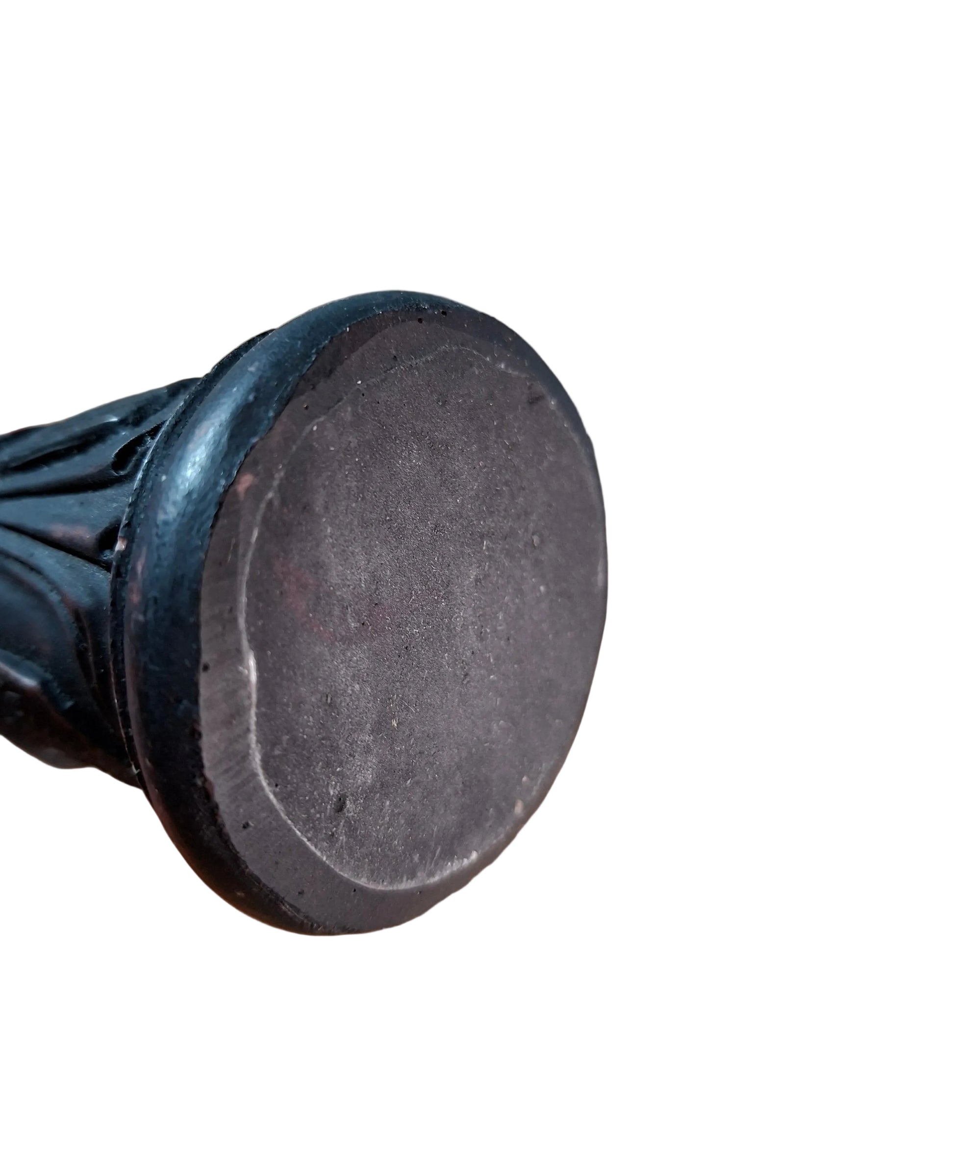 Bottom view of a Antique Carved Resin Asian Figure-Statue