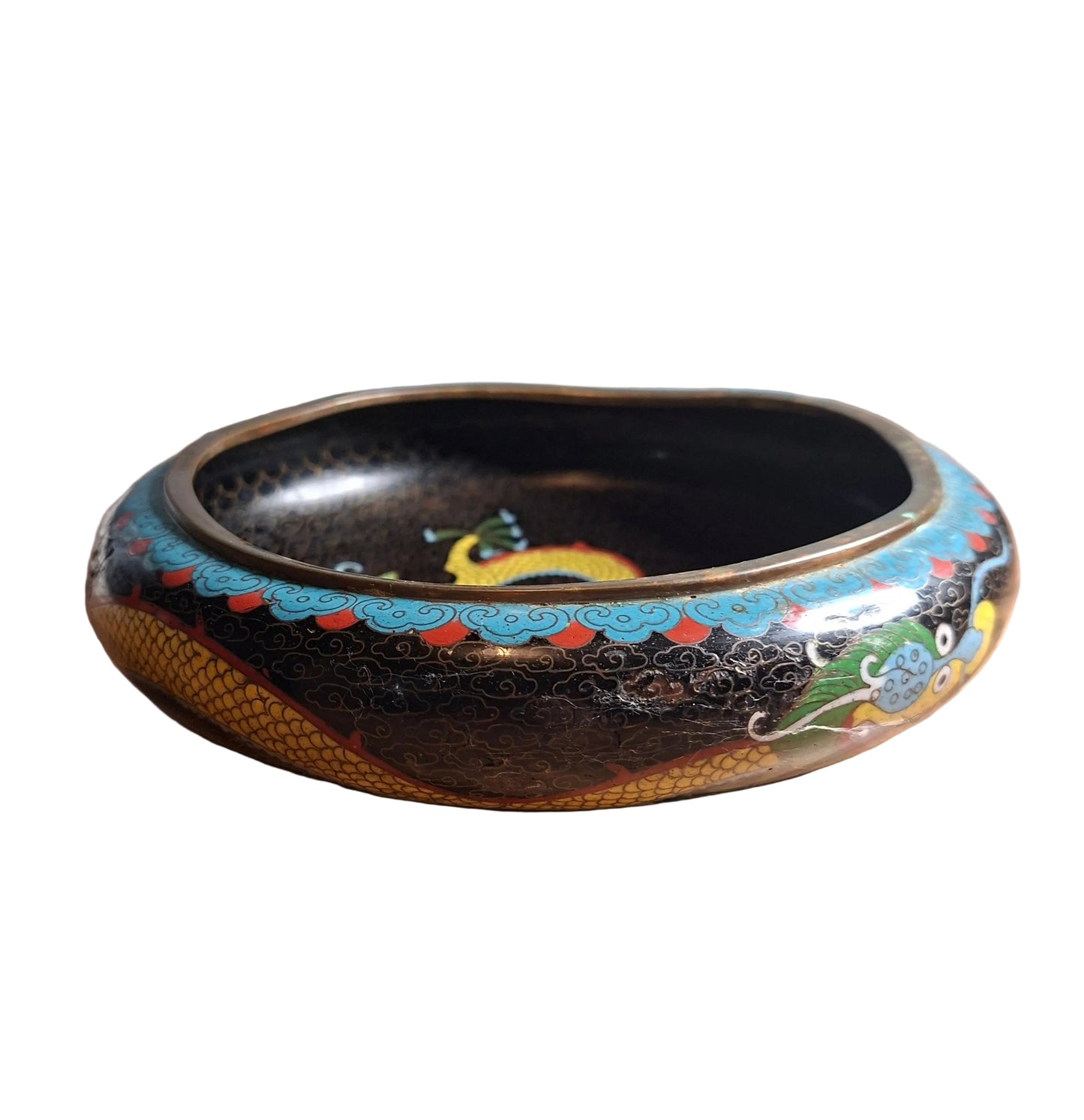 An Antique cloisonne low brass bowl with a dynamic dragon motif