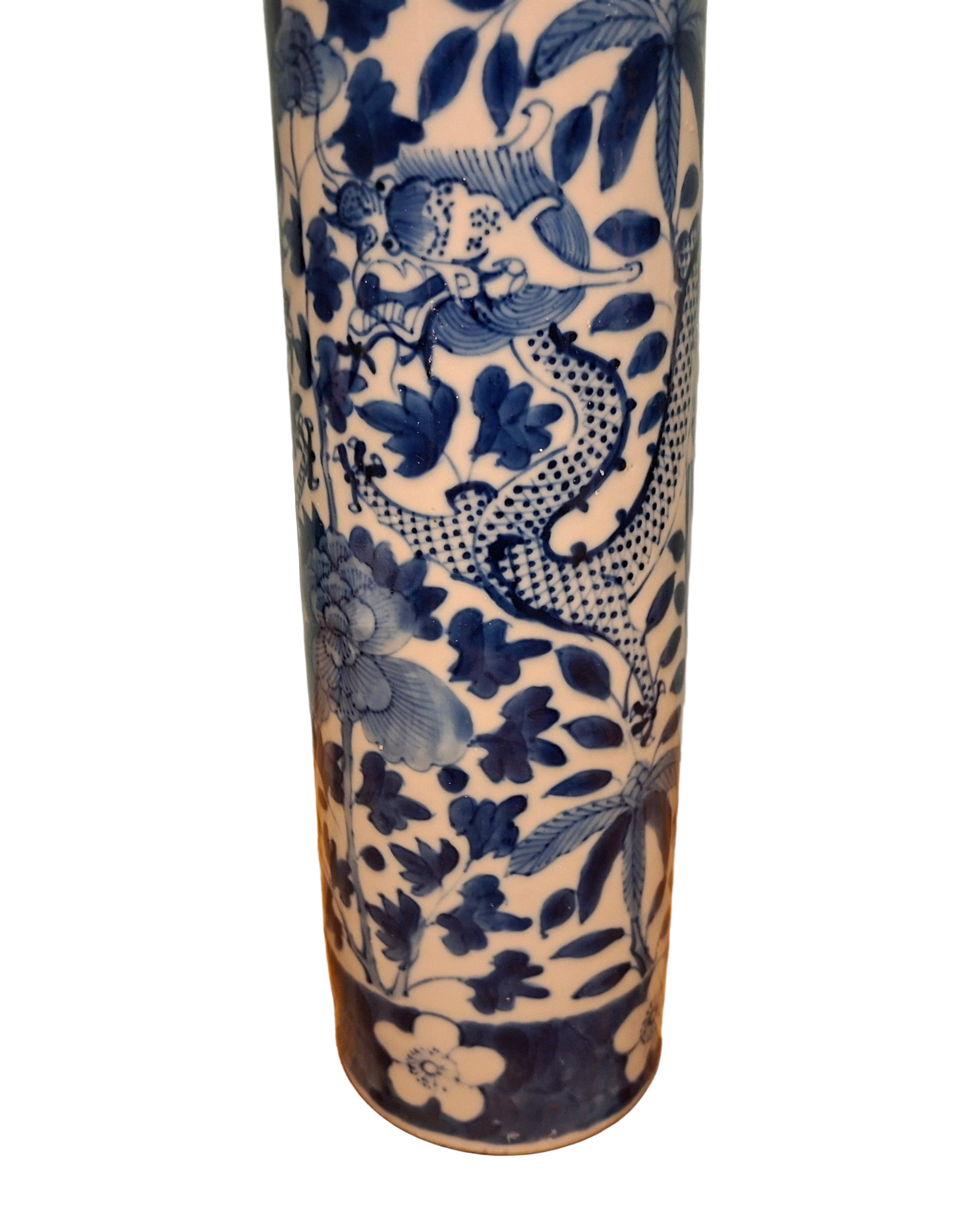 Qing Dynasty Cylindrical ceramic vase with blue floral patterns on a wooden surface and gray background