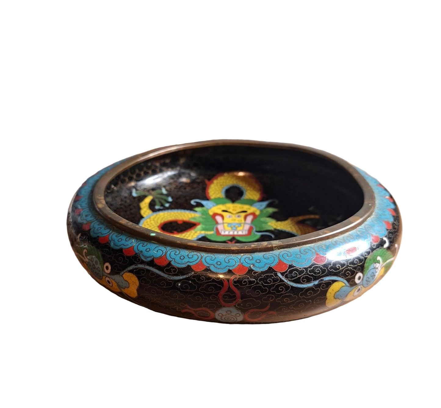 A stunning Antique Chinese brass bowl with a dynamic dragon motif