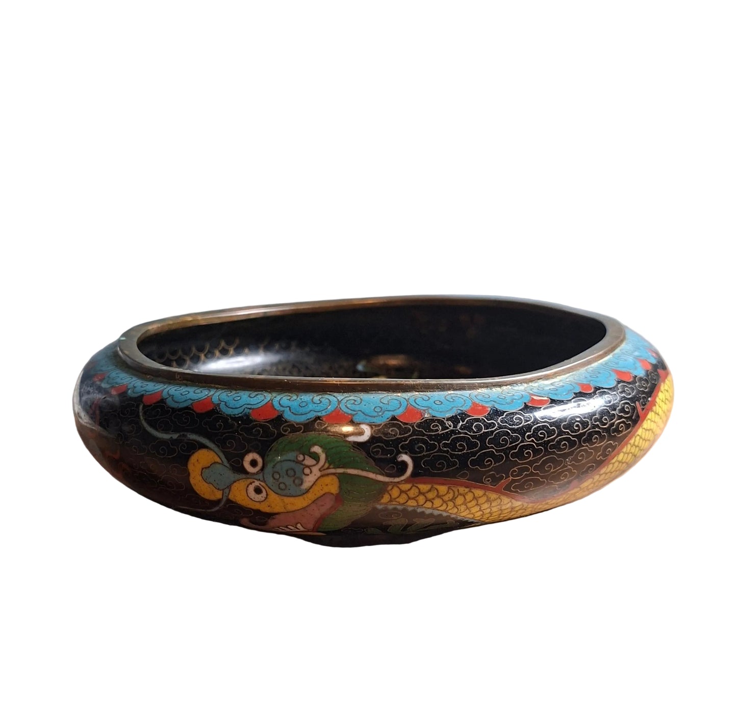 A late Qing dynasty Chinese cloisonne low brass bowl with a dynamic dragon motif