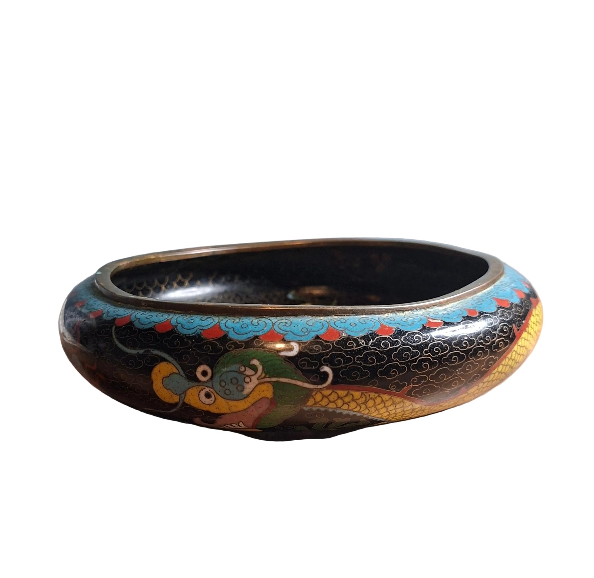A late Qing dynasty Chinese cloisonne low brass bowl with a dynamic dragon motif