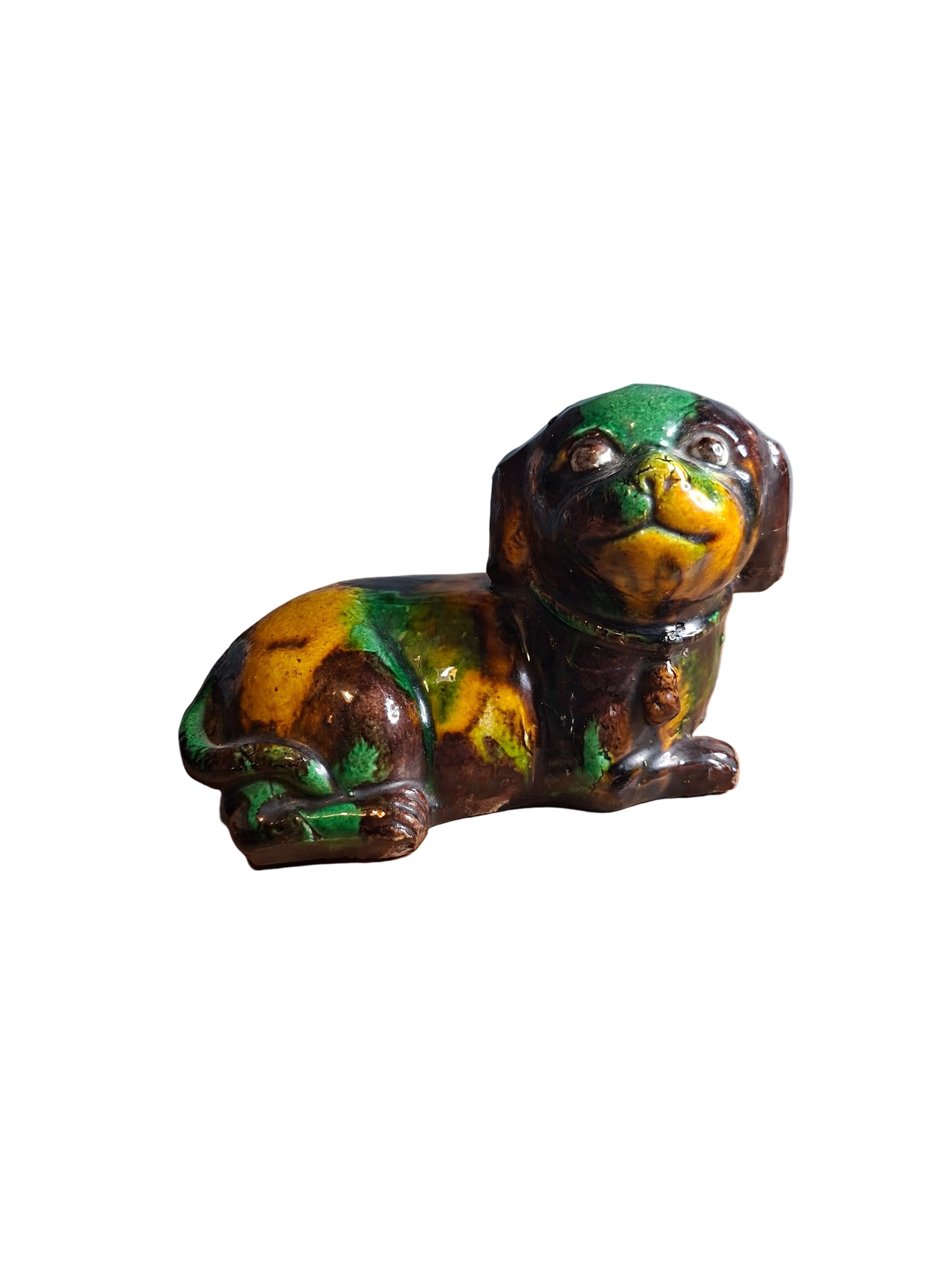 Chinese Kangxi 'egg and spinach'-glazed biscuit porcelain figure of a dog.