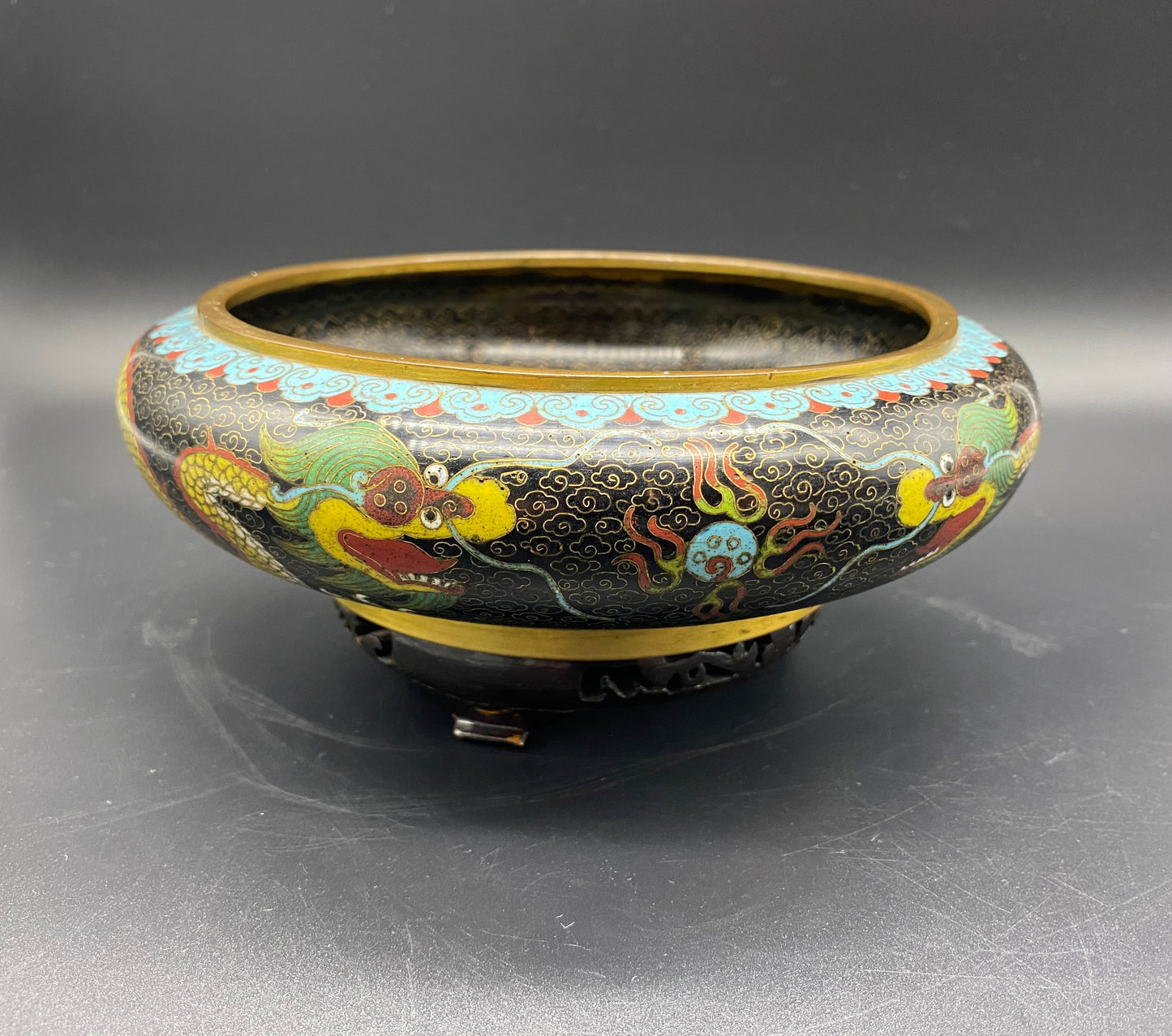 Chinese cloisonné and Japanese cloisonné, look closely at the surface. Generally, Japanese cloisonné looks glassy because of the grinding and buffing process used to produce it