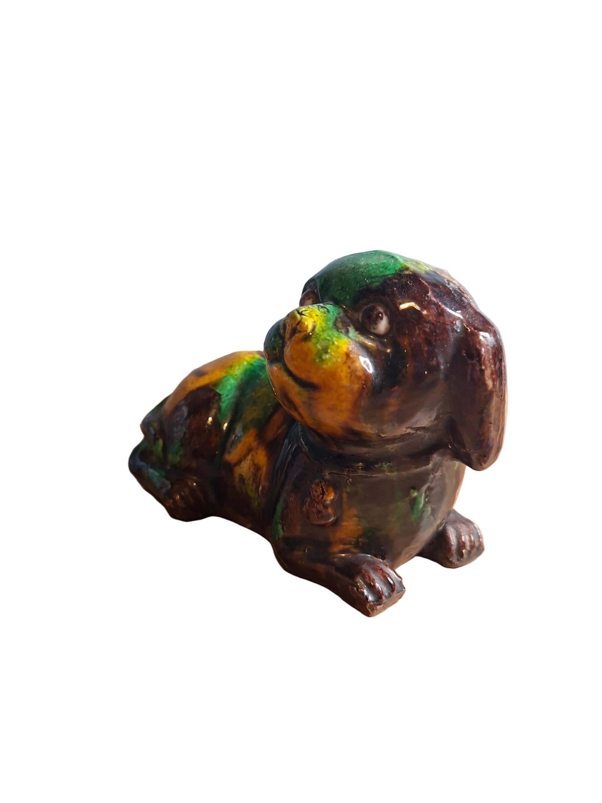 Chinese Kangxi Dynasty 'egg and spinach'-glazed biscuit porcelain figure of a dog.