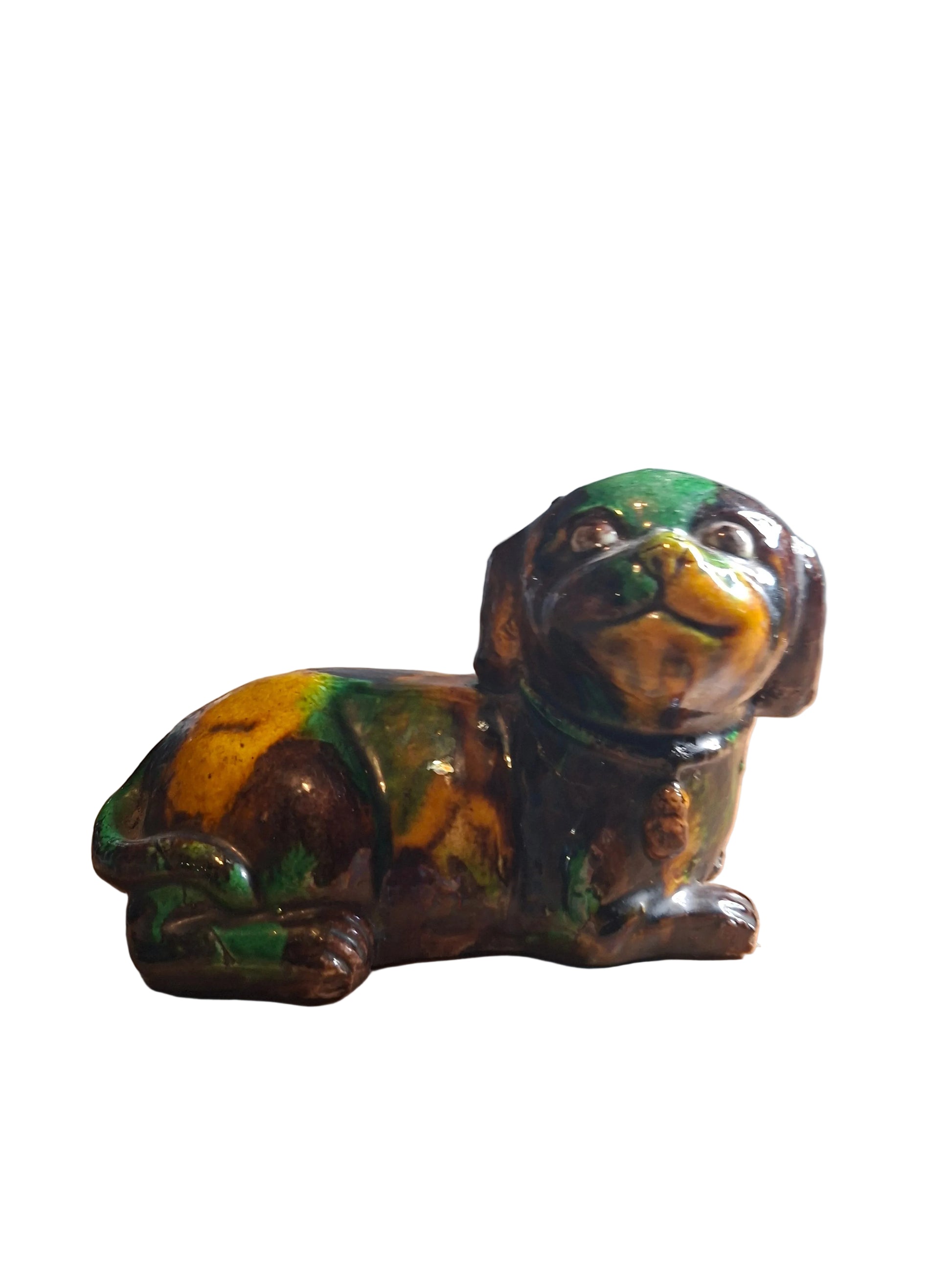 Old Chinese Kangxi 'egg and spinach'-glazed biscuit porcelain figure of a dog.