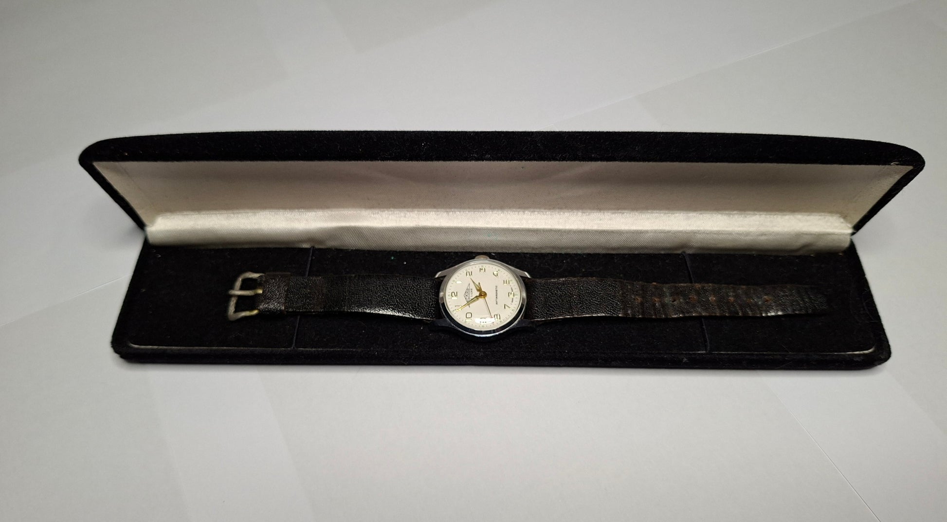 vintage Swiss Watch with cream dial,  gold hands and numbers with sweeping red tipped seconds hand