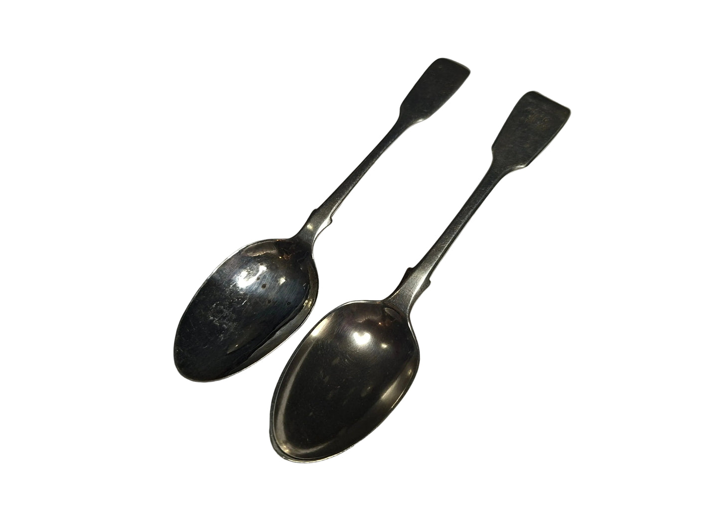 A pair of Antique Victorian Silver Spoons, hallmarked London 1845 and 1863. Crafted in solid silver with a combined weight of 41 grams