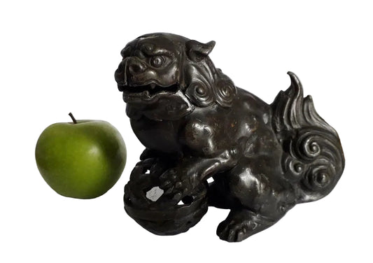 A striking Chinese bronze Foo Dog, also known as an Imperial Guardian Lion, dates to the early–mid 20th century and embodies centuries of protective symbolism. 
