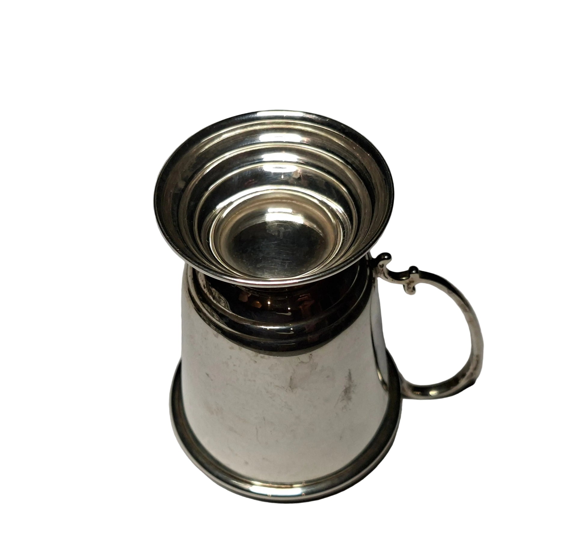 Silver cup with handle on a white background